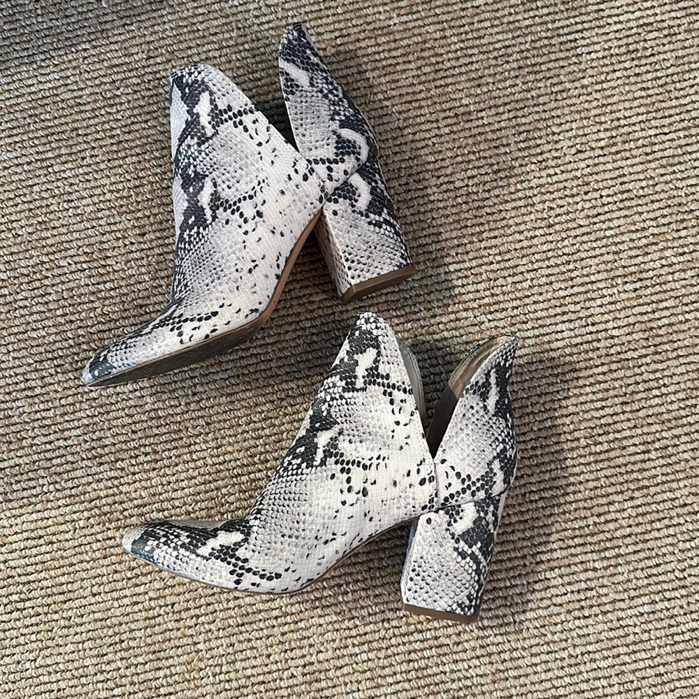 Steve Madden snake skin heeled boot.